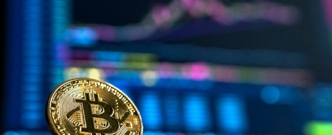 Bitcoin coin on financial market charts - cryptocurrency taxation and MiCA