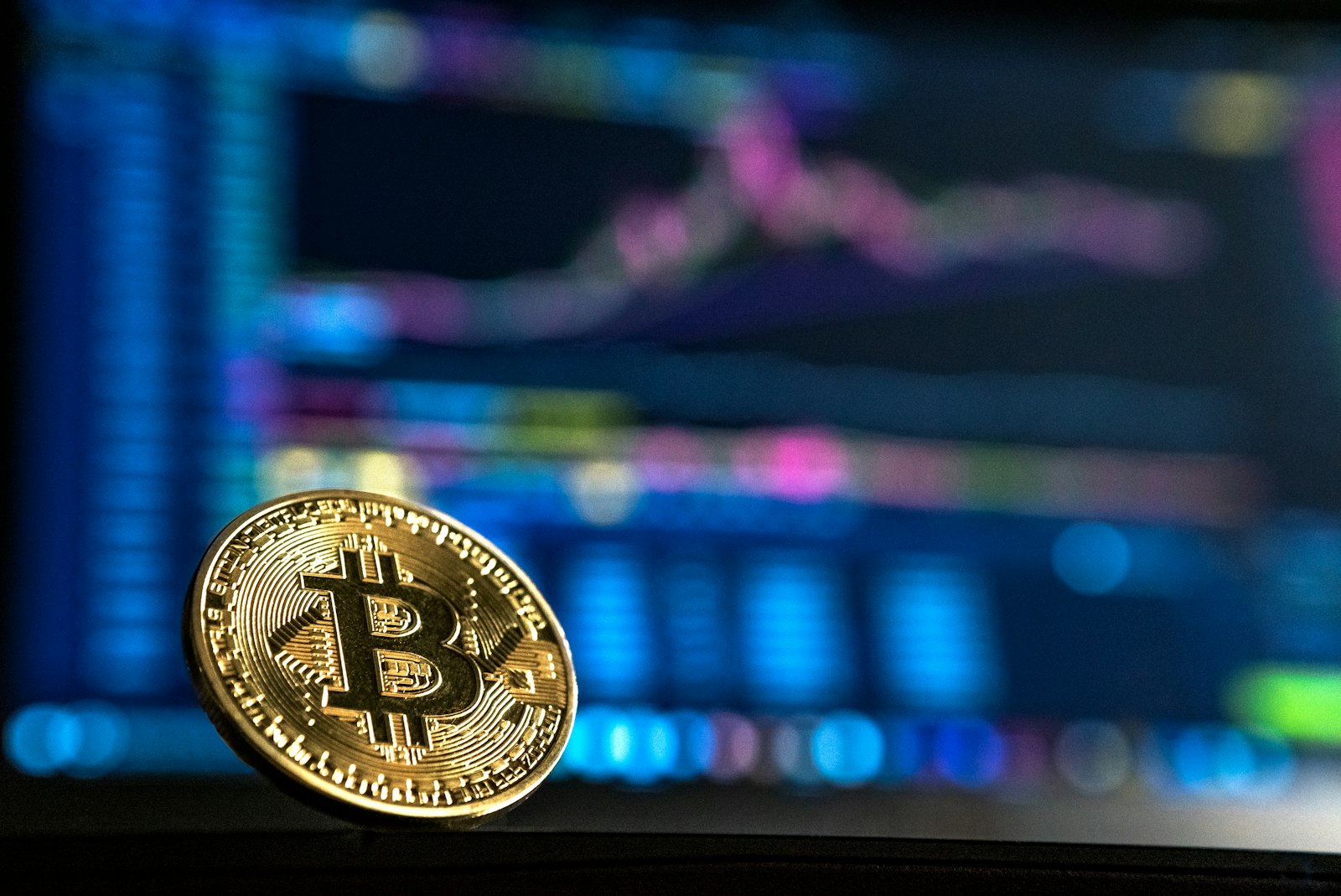 Bitcoin coin on financial market charts - cryptocurrency taxation and MiCA